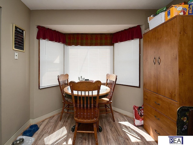 2103 Randall Dr, Bellevue, NE 68005 - dining area featuring baseboards and wood finished floors