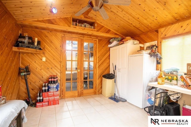 5431 S 48th Ave, Omaha, NE 68117 - dining space with tile patterned flooring, wooden walls, french doors, wooden ceiling, and ceiling fan