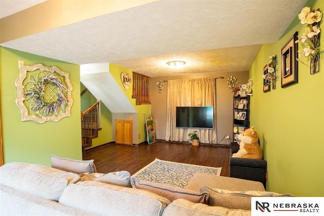 5431 S 48th Ave, Omaha, NE 68117 - living room with dark wood finished floors, a textured ceiling, and baseboards