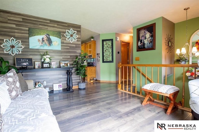 5431 S 48th Ave, Omaha, NE 68117 - living area featuring wood finished floors, a chandelier, and baseboards