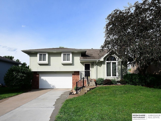 15211 Pasadena Ave, Omaha, NE 68144 - split level home with driveway, brick siding, a front lawn, and an attached garage