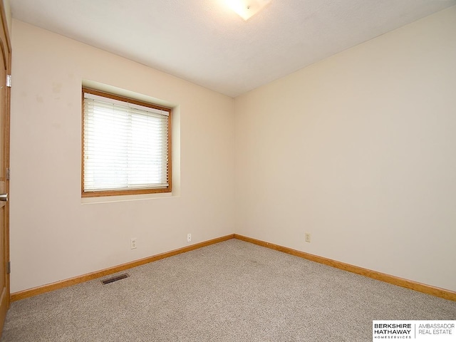 15211 Pasadena Ave, Omaha, NE 68144 - carpeted spare room with baseboards