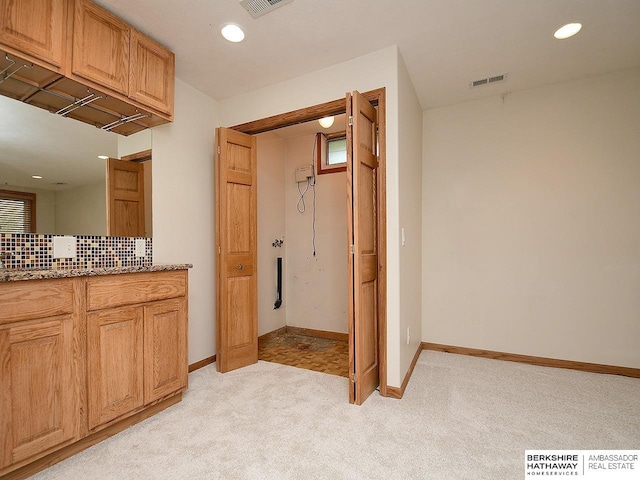 15211 Pasadena Ave, Omaha, NE 68144 - bathroom with decorative backsplash, vanity, recessed lighting, and carpet flooring