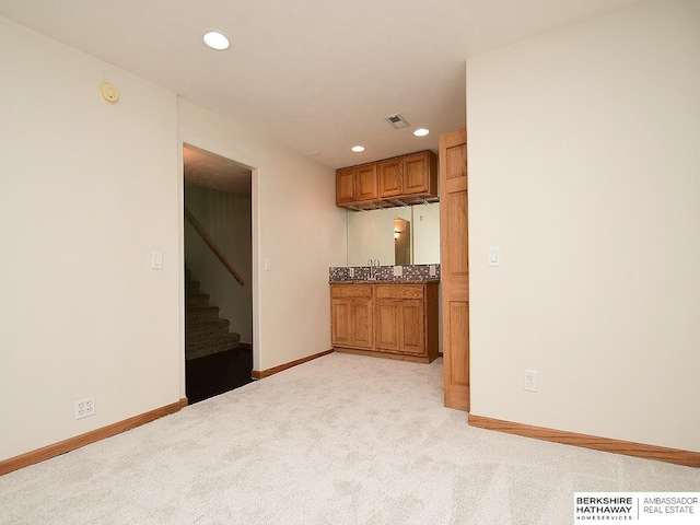 15211 Pasadena Ave, Omaha, NE 68144 - bar area with stairs, light carpet, and recessed lighting