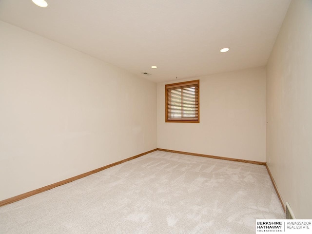 15211 Pasadena Ave, Omaha, NE 68144 - empty room with light carpet and recessed lighting