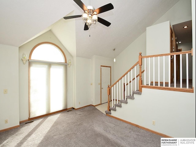 15211 Pasadena Ave, Omaha, NE 68144 - unfurnished living room featuring lofted ceiling, ceiling fan, and carpet