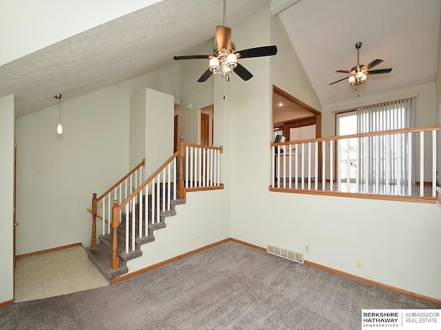 15211 Pasadena Ave, Omaha, NE 68144 - unfurnished living room with ceiling fan, carpet flooring, and high vaulted ceiling