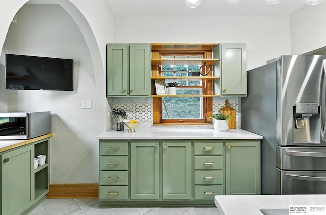 2311 N 51st St, Omaha, NE 68104 - kitchen featuring green cabinetry, stainless steel appliances, and open shelves