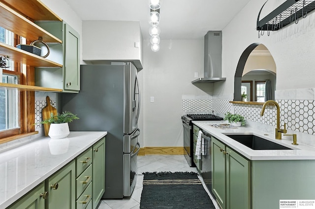 2311 N 51st St, Omaha, NE 68104 - kitchen featuring green cabinetry and wall chimney exhaust hood