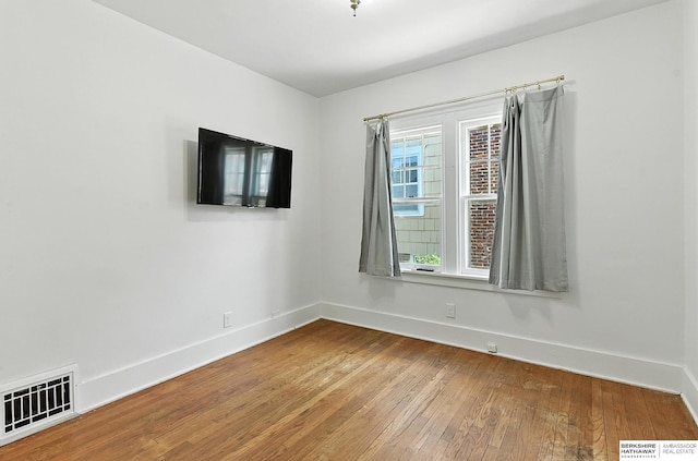 2311 N 51st St, Omaha, NE 68104 - spare room featuring wood-type flooring and baseboards