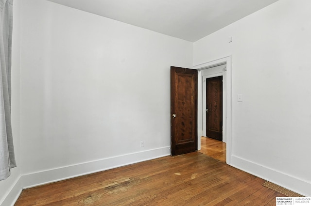 2311 N 51st St, Omaha, NE 68104 - unfurnished room with hardwood / wood-style flooring and baseboards