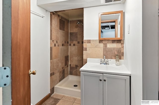 2311 N 51st St, Omaha, NE 68104 - bathroom featuring tiled shower and vanity