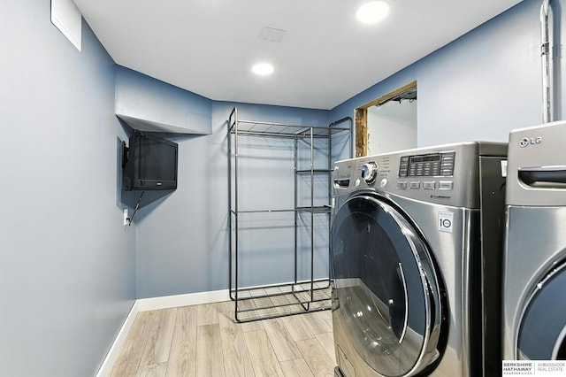 2311 N 51st St, Omaha, NE 68104 - washroom with separate washer and dryer, wood finished floors, and recessed lighting