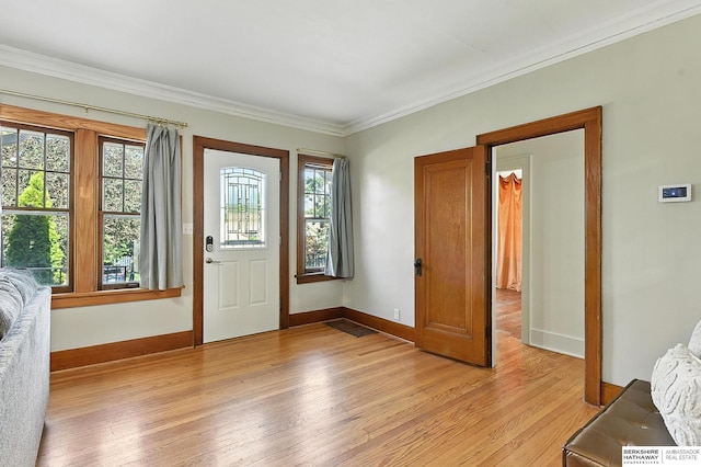 2311 N 51st St, Omaha, NE 68104 - entrance foyer with light wood-type flooring, plenty of natural light, and ornamental molding