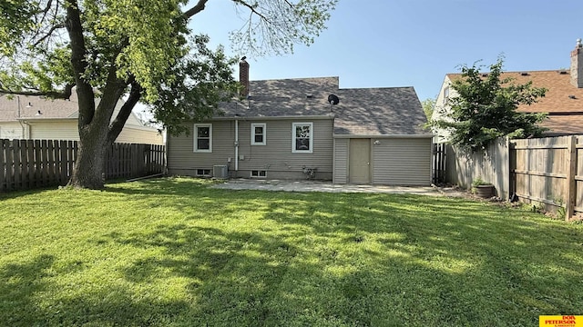 1506 E 1st St, Fremont, NE 68025 - back of property featuring a patio, central air condition unit, and a chimney