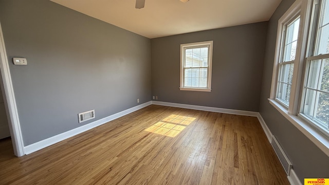 1506 E 1st St, Fremont, NE 68025 - unfurnished room with healthy amount of natural light, baseboards, and wood finished floors