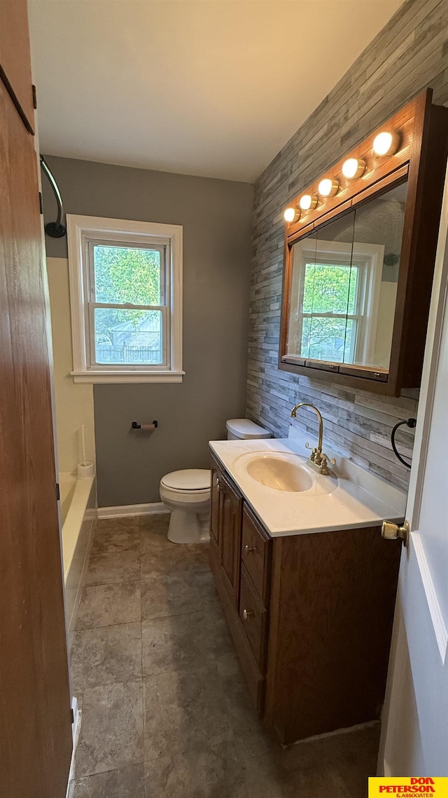 1506 E 1st St, Fremont, NE 68025 - full bath with plenty of natural light, vanity, toilet, and bathtub / shower combination