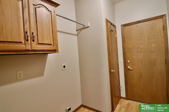 2330 N 133rd Cir, Omaha, NE 68164 - laundry room featuring hookup for an electric dryer, light wood-style flooring, cabinet space, and baseboards