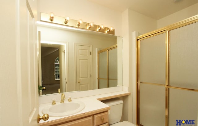 6427 Lone Tree Dr, Lincoln, NE 68512 - bathroom with vanity, toilet, and a shower with door