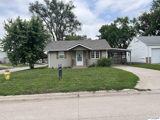 6048 P St, Omaha, NE 68117 - view of front of property featuring driveway, a front yard, an attached carport, and a chimney