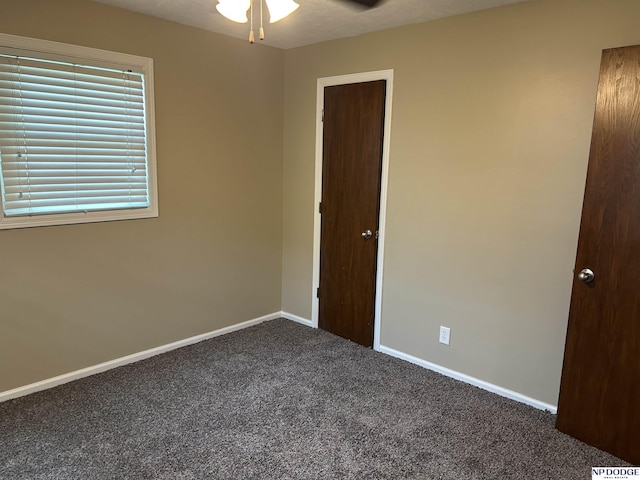 6048 P St, Omaha, NE 68117 - unfurnished bedroom with carpet flooring and baseboards