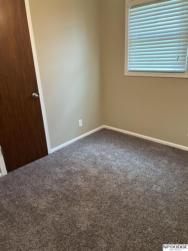 6048 P St, Omaha, NE 68117 - carpeted empty room featuring baseboards