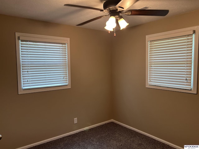 6048 P St, Omaha, NE 68117 - carpeted spare room with ceiling fan and baseboards