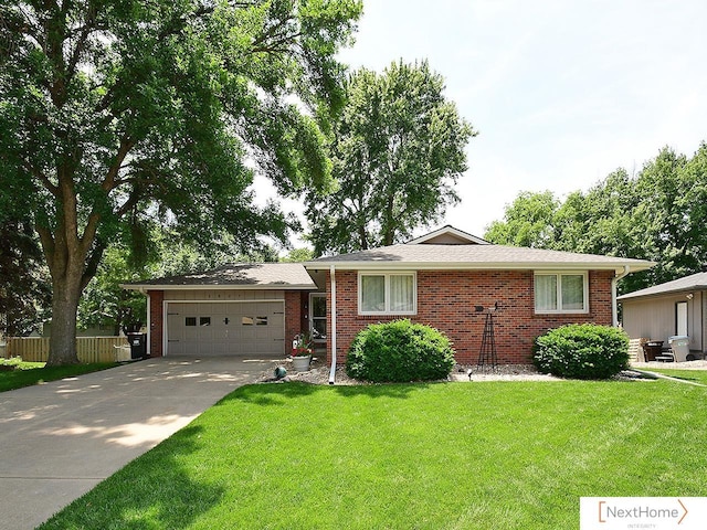 5827 Skylark Ln, Lincoln, NE 68516 - ranch-style house with a garage, brick siding, and concrete driveway