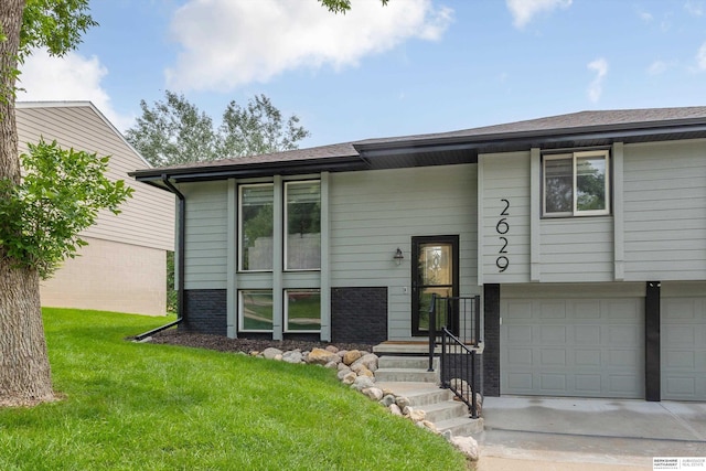 2629 N 129th Cir, Omaha, NE 68164 - bi-level home featuring a front lawn, driveway, and an attached garage