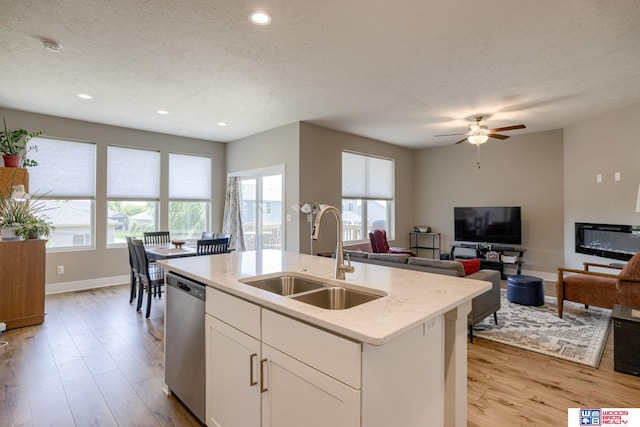 1637 W Avalanche Rd, Lincoln, NE 68521 - kitchen with dishwasher, healthy amount of natural light, light wood-style flooring, ceiling fan, and recessed lighting
