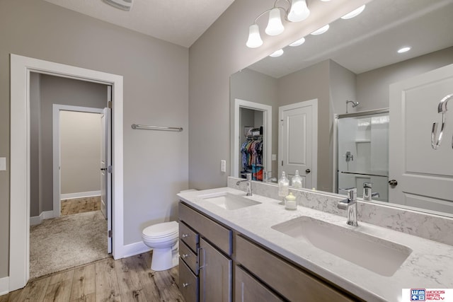 1637 W Avalanche Rd, Lincoln, NE 68521 - full bath featuring a shower stall, double vanity, wood finished floors, and a walk in closet