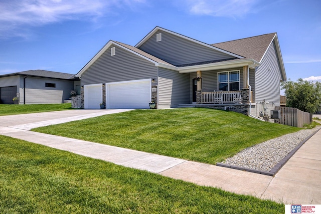 1637 W Avalanche Rd, Lincoln, NE 68521 - ranch-style home with covered porch, an attached garage, concrete driveway, stone siding, and roof with shingles