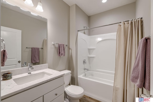 1637 W Avalanche Rd, Lincoln, NE 68521 - bathroom featuring shower / bathtub combination with curtain, vanity, wood finished floors, and recessed lighting