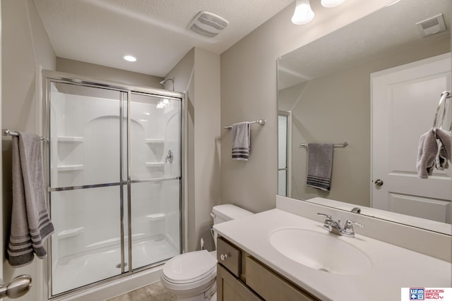 1637 W Avalanche Rd, Lincoln, NE 68521 - bathroom with a shower stall, vanity, and a textured ceiling