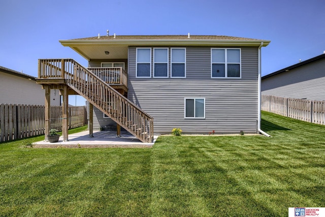 1637 W Avalanche Rd, Lincoln, NE 68521 - rear view of property with a fenced backyard, stairs, a deck, and a patio area