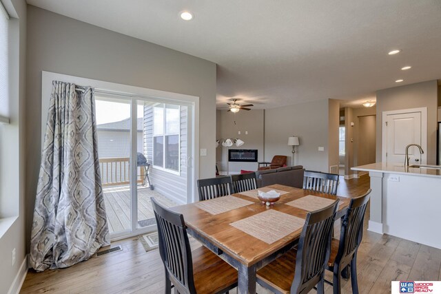 1637 W Avalanche Rd, Lincoln, NE 68521 - dining room featuring light wood-style floors, a ceiling fan, and recessed lighting