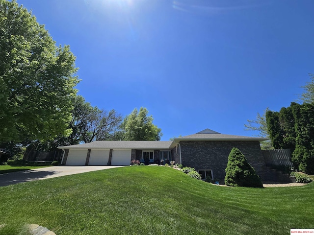 1807 S 16th Circle Dr, Beatrice, NE 68310 - ranch-style home featuring an attached garage, concrete driveway, a front yard, and brick siding