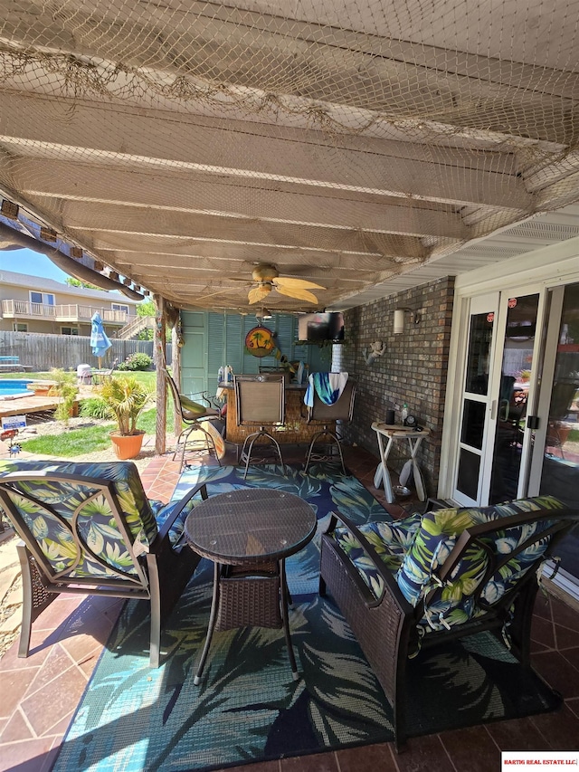 1807 S 16th Circle Dr, Beatrice, NE 68310 - view of patio / terrace with outdoor dining space, ceiling fan, and french doors