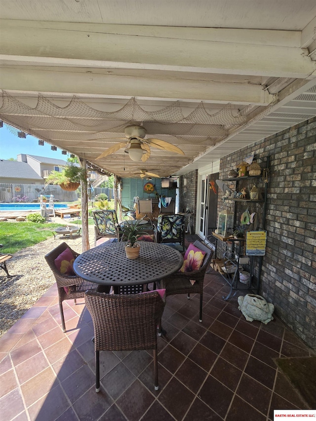 1807 S 16th Circle Dr, Beatrice, NE 68310 - view of patio / terrace featuring outdoor dining area and a ceiling fan