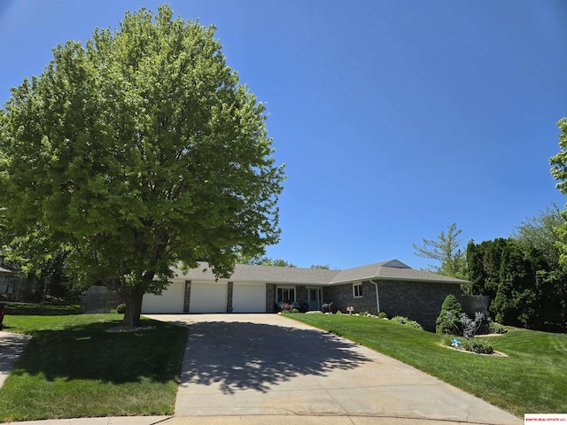 1807 S 16th Circle Dr, Beatrice, NE 68310 - view of front facade with concrete driveway and an attached garage