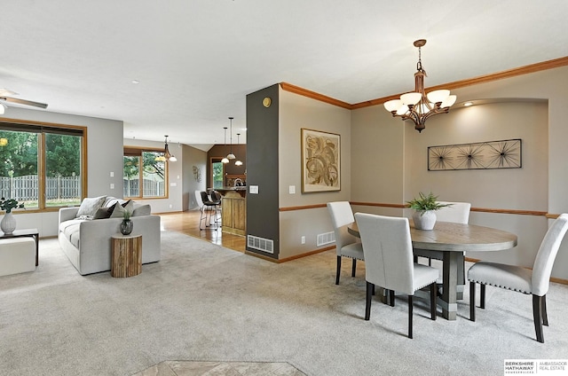 5418 S 165th St, Omaha, NE 68135 - dining space featuring carpet, a chandelier, and ornamental molding