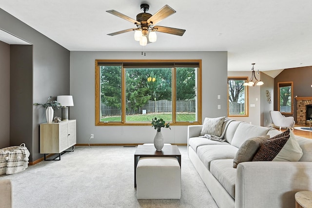 5418 S 165th St, Omaha, NE 68135 - carpeted living room featuring plenty of natural light, a chandelier, and a ceiling fan