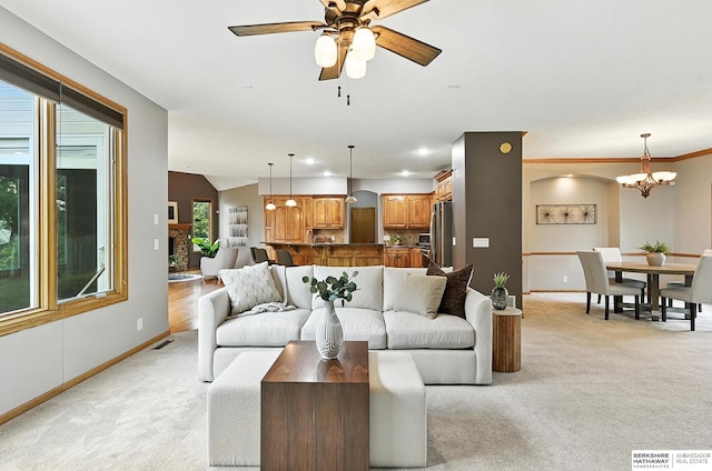 5418 S 165th St, Omaha, NE 68135 - living room with light carpet, a chandelier, and ceiling fan