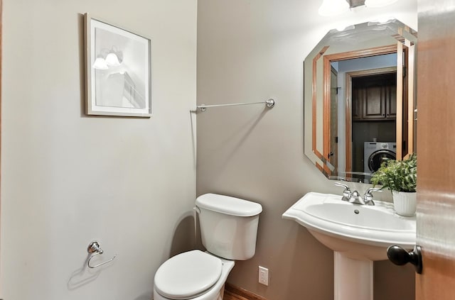5418 S 165th St, Omaha, NE 68135 - bathroom with toilet and washer / clothes dryer