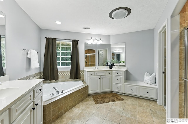 5418 S 165th St, Omaha, NE 68135 - bathroom with a shower stall, two vanities, a bath, and tile patterned floors