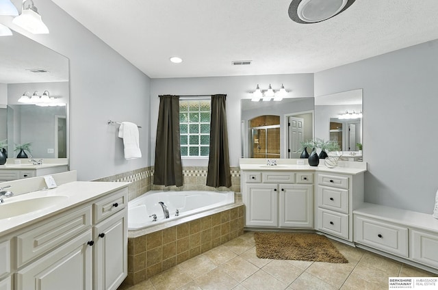 5418 S 165th St, Omaha, NE 68135 - bathroom with a stall shower, two vanities, a bath, and tile patterned floors