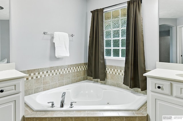 5418 S 165th St, Omaha, NE 68135 - bathroom featuring vanity, a tub with jets, and plenty of natural light