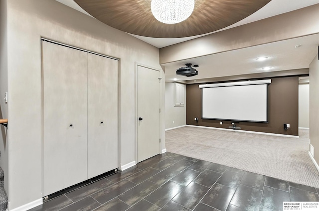 5418 S 165th St, Omaha, NE 68135 - home theater room with a chandelier and dark carpet