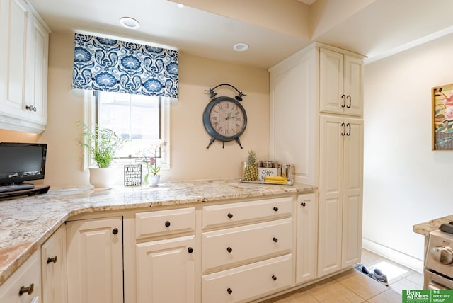 523 N 52nd St, Omaha, NE 68132 - kitchen with light stone countertops and light tile patterned floors