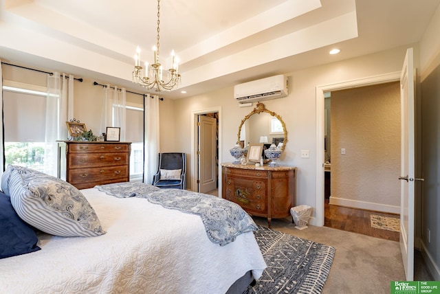 523 N 52nd St, Omaha, NE 68132 - bedroom featuring a wall unit AC, a chandelier, recessed lighting, a raised ceiling, and carpet flooring